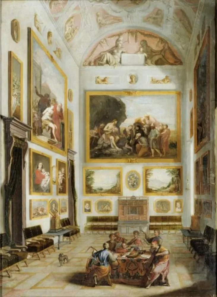 Interior with a collection of paintings and musicians around a table